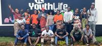 YouthLife - Group of happy kids with banner